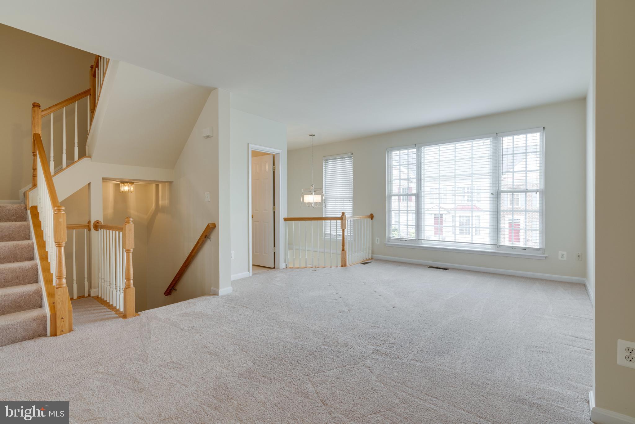 9058 Two Bays Road Lorton, VA 22079 - Photo 26 of 42 Living Room Overview going to upper level