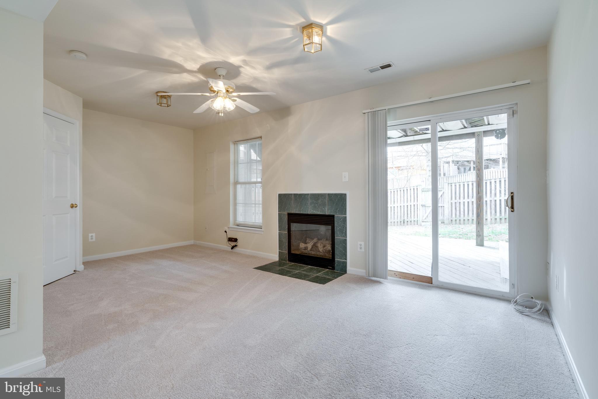 9058 Two Bays Road Lorton, VA 22079 - Photo 7 of 42 Family room w/gas fireplace & doors to deck & yard