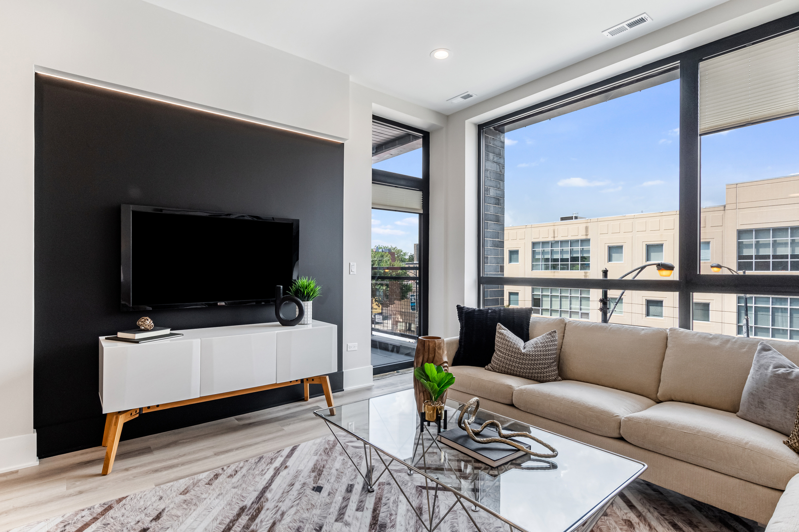 Undisclosed Address Chicago, IL 60660 - Photo 6 of 18 a living room with furniture and a flat screen tv