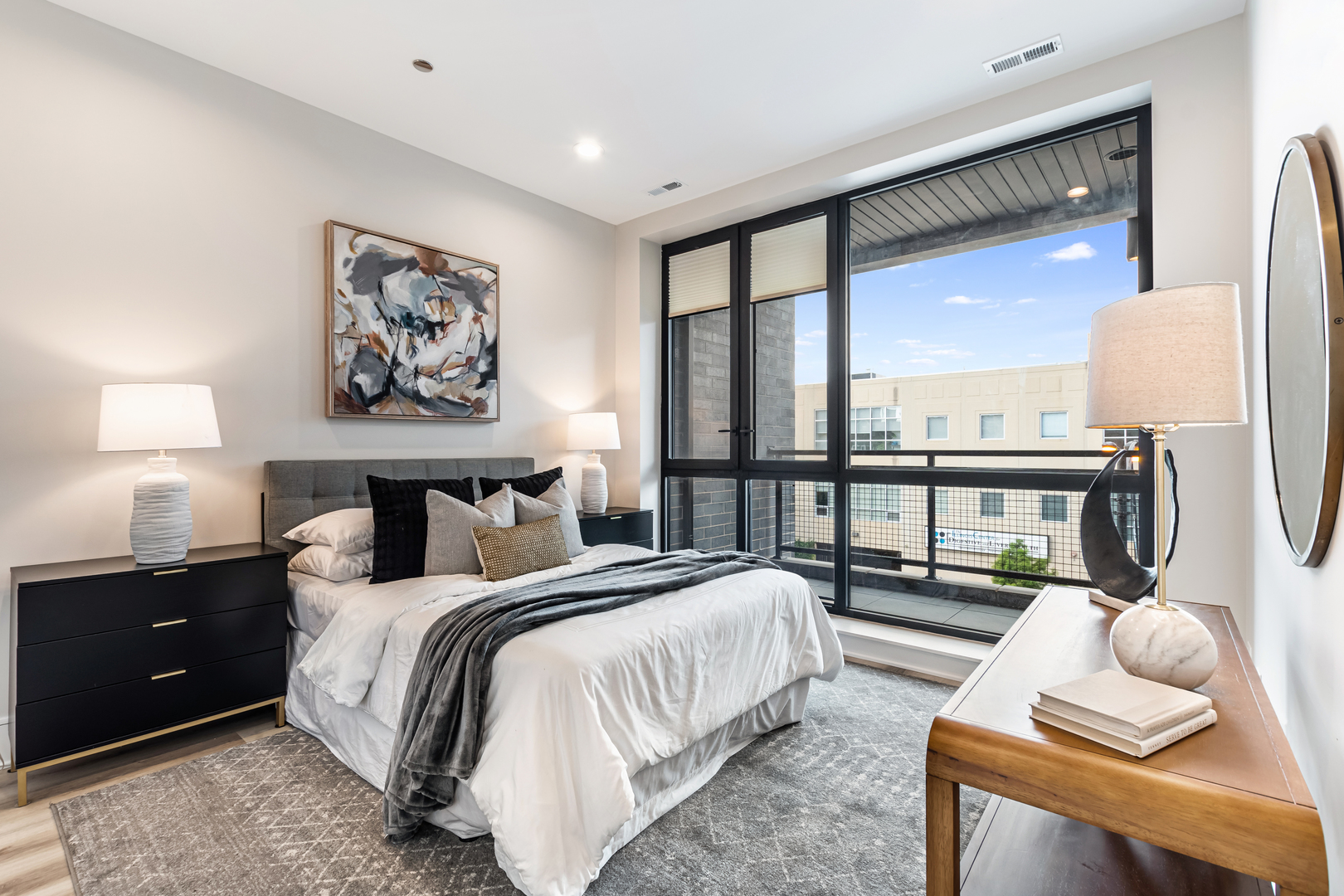Undisclosed Address Chicago, IL 60660 - Photo 7 of 18 a spacious bedroom with a bed and a large window