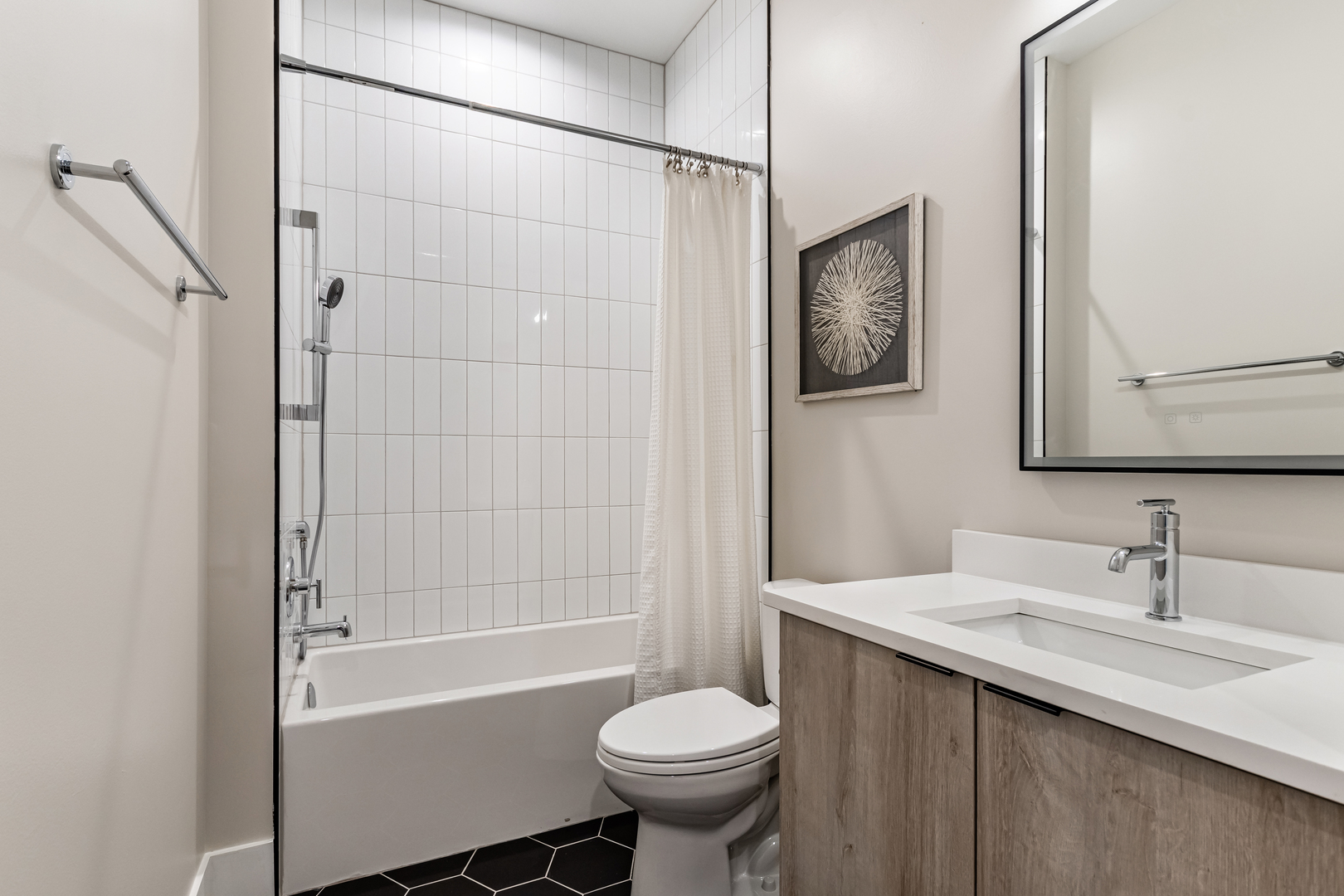 Undisclosed Address Chicago, IL 60660 - Photo 9 of 18 a bathroom with a sink toilet and shower