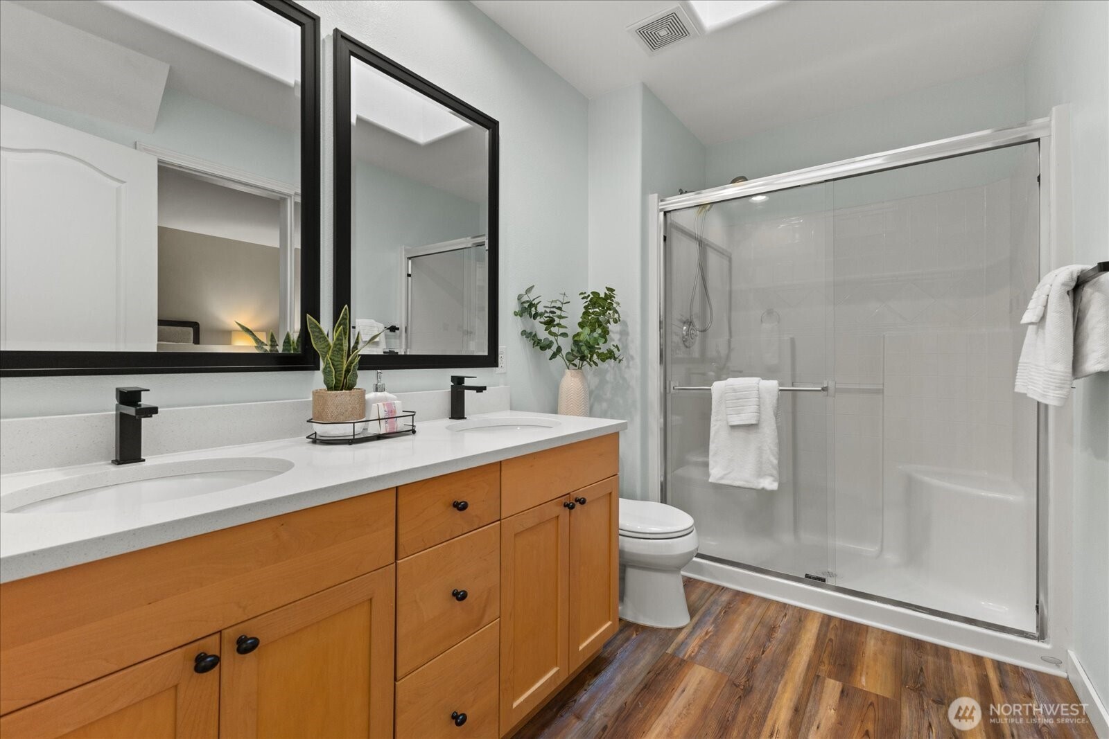 16526 Southeast 256th Street, Unit C3 Covington, WA 98042 - Photo 13 of 26 a bathroom with a double vanity sink toilet and shower