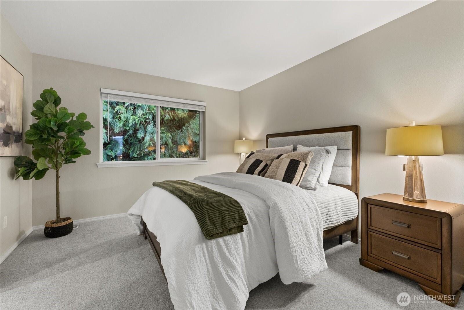 16526 Southeast 256th Street, Unit C3 Covington, WA 98042 - Photo 15 of 26 a bedroom with a bed and a potted plant