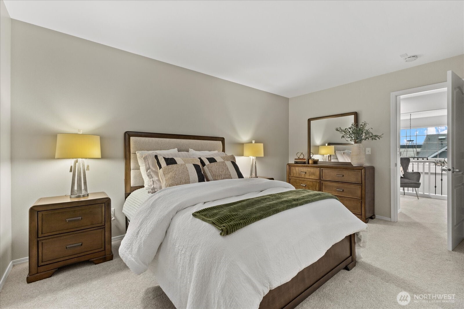 16526 Southeast 256th Street, Unit C3 Covington, WA 98042 - Photo 17 of 26 a bedroom with a bed and wooden floor