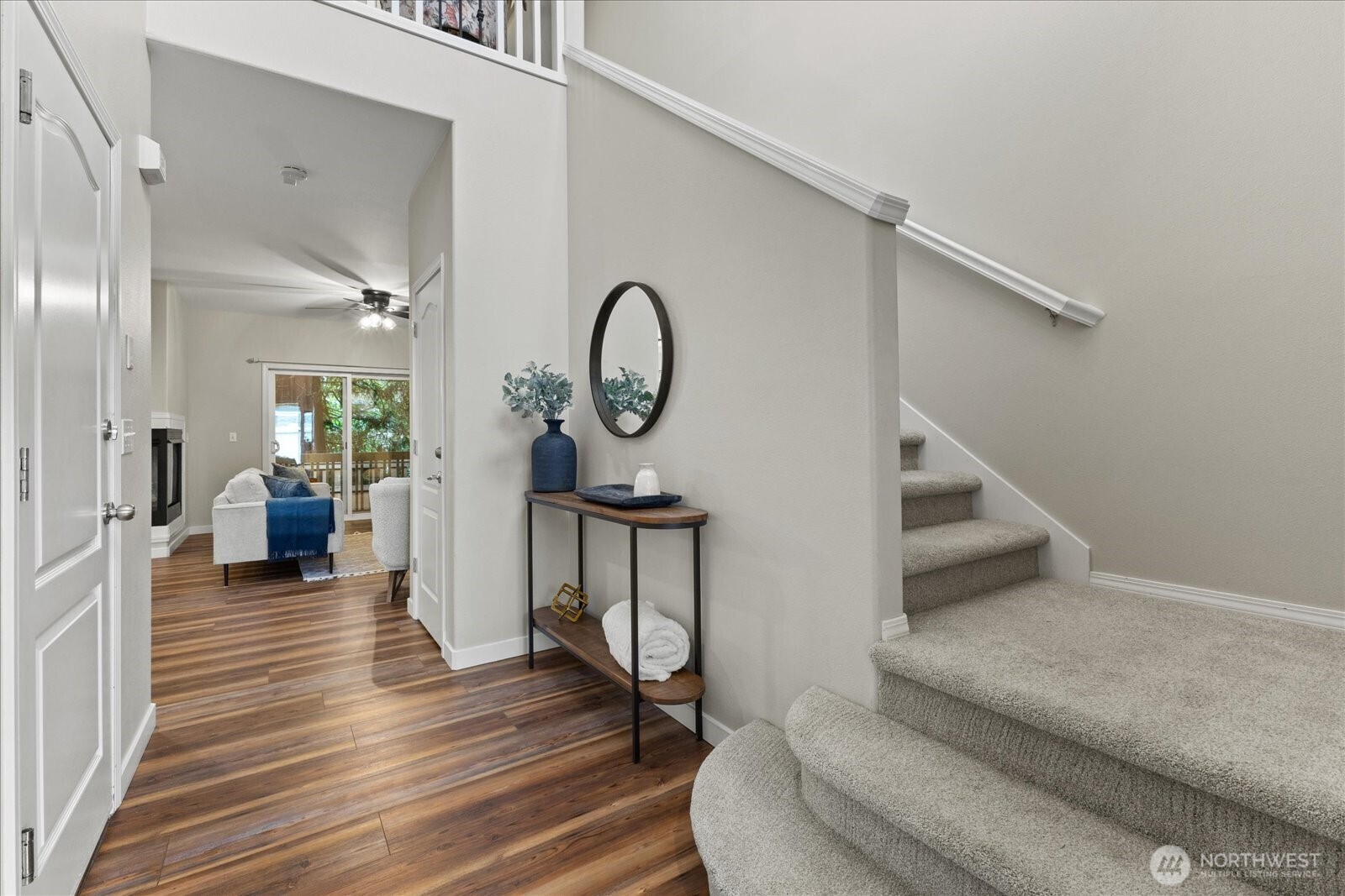 16526 Southeast 256th Street, Unit C3 Covington, WA 98042 - Photo 2 of 26 a living room with furniture and a wooden floor