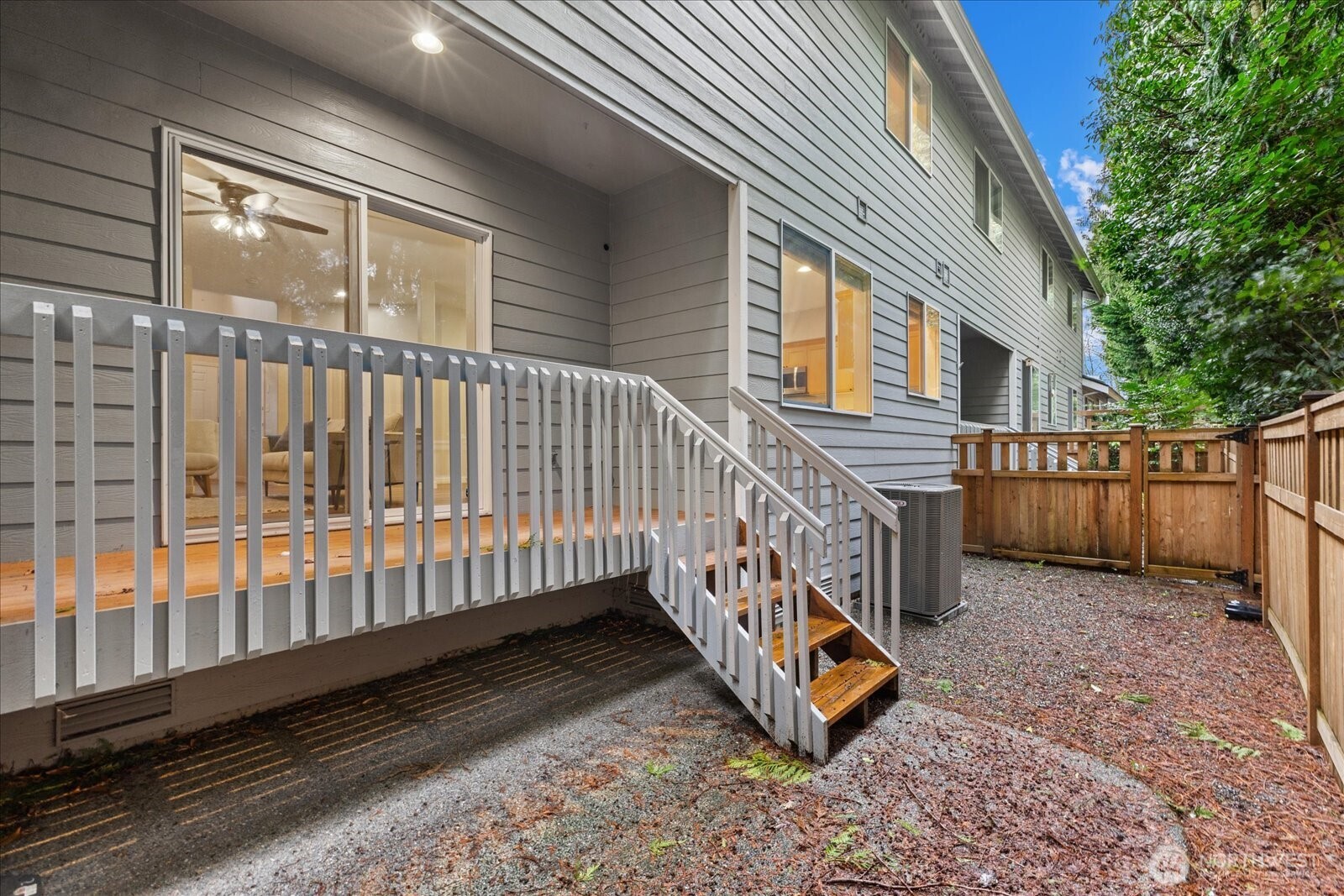 16526 Southeast 256th Street, Unit C3 Covington, WA 98042 - Photo 22 of 26 a view of a deck with wooden floor and fence
