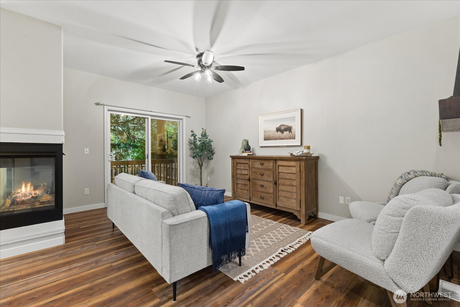16526 Southeast 256th Street, Unit C3 Covington, WA 98042 - Photo 3 of 26 a living room with furniture and a fireplace