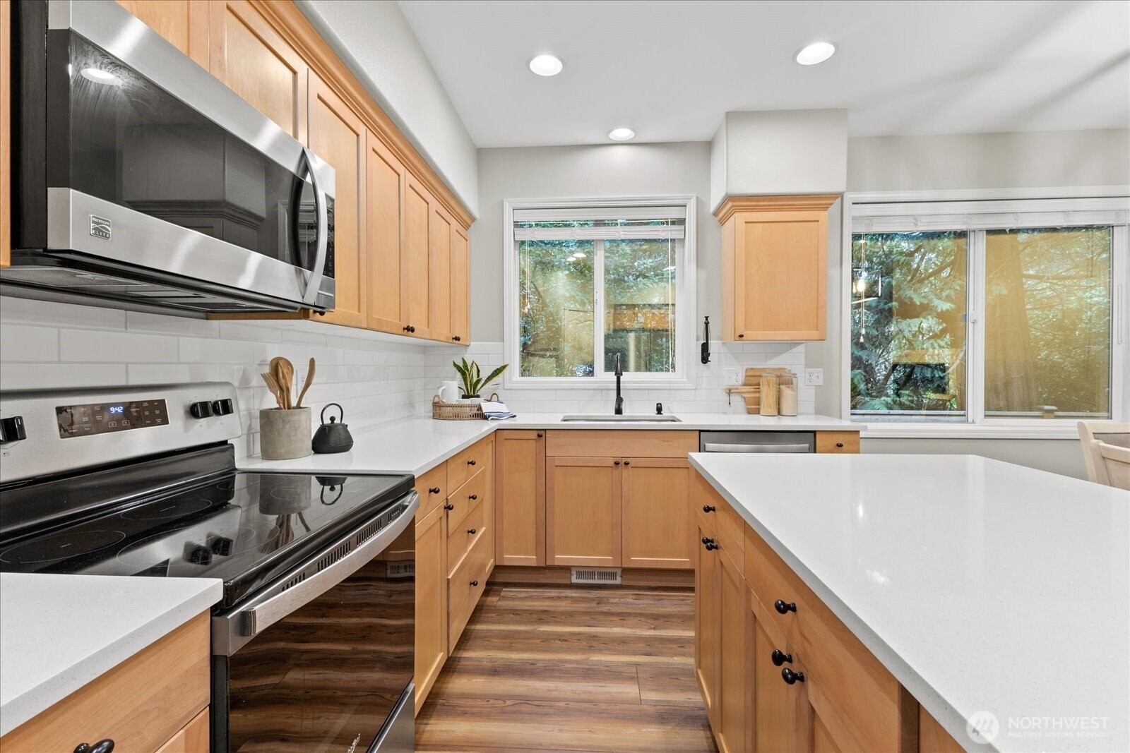 16526 Southeast 256th Street, Unit C3 Covington, WA 98042 - Photo 10 of 26 a kitchen with stainless steel appliances a sink stove and cabinets