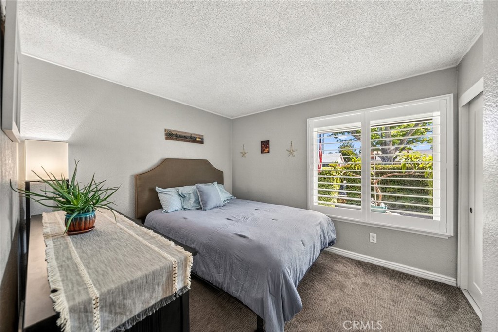 4040 Penrod Drive Riverside, CA 92505 - Photo 18 of 30 a bedroom with a bed and a window
