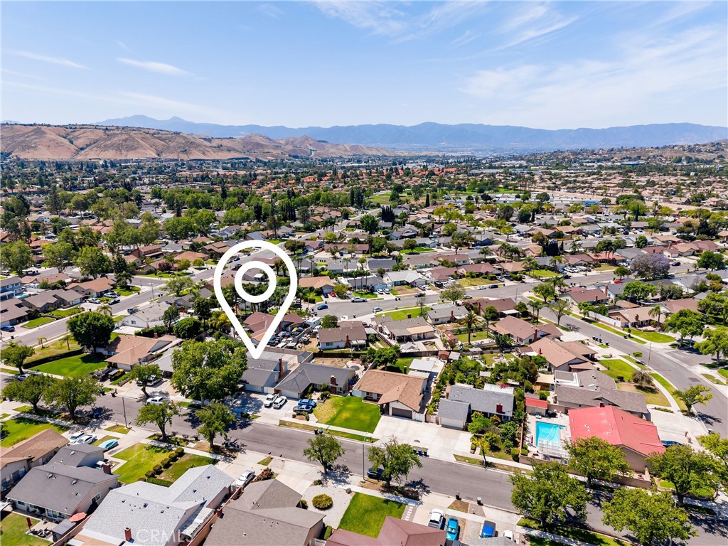 4040 Penrod Drive Riverside, CA 92505 - Photo 27 of 30 an aerial view of a city with lots of residential buildings and mountain view in back