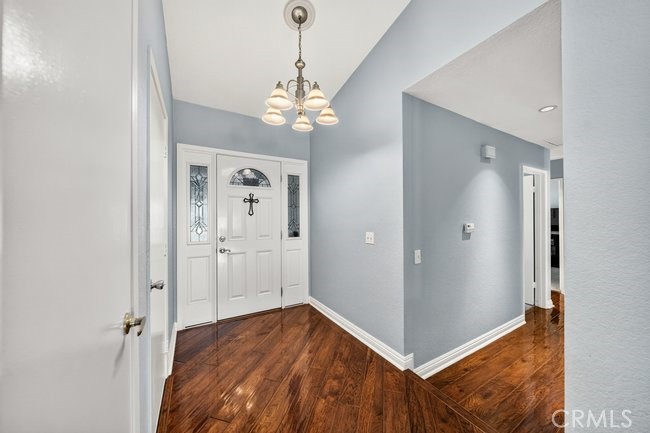 4040 Penrod Drive Riverside, CA 92505 - Photo 5 of 30 a view of a hallway with a chandelier