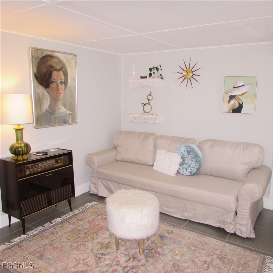16111 Tortuga Street Bokeelia, FL 33922 - Photo 12 of 29 a living room with furniture and a couch