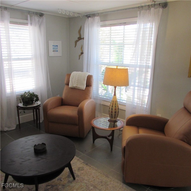 16111 Tortuga Street Bokeelia, FL 33922 - Photo 15 of 29 a living room with furniture and a lamp