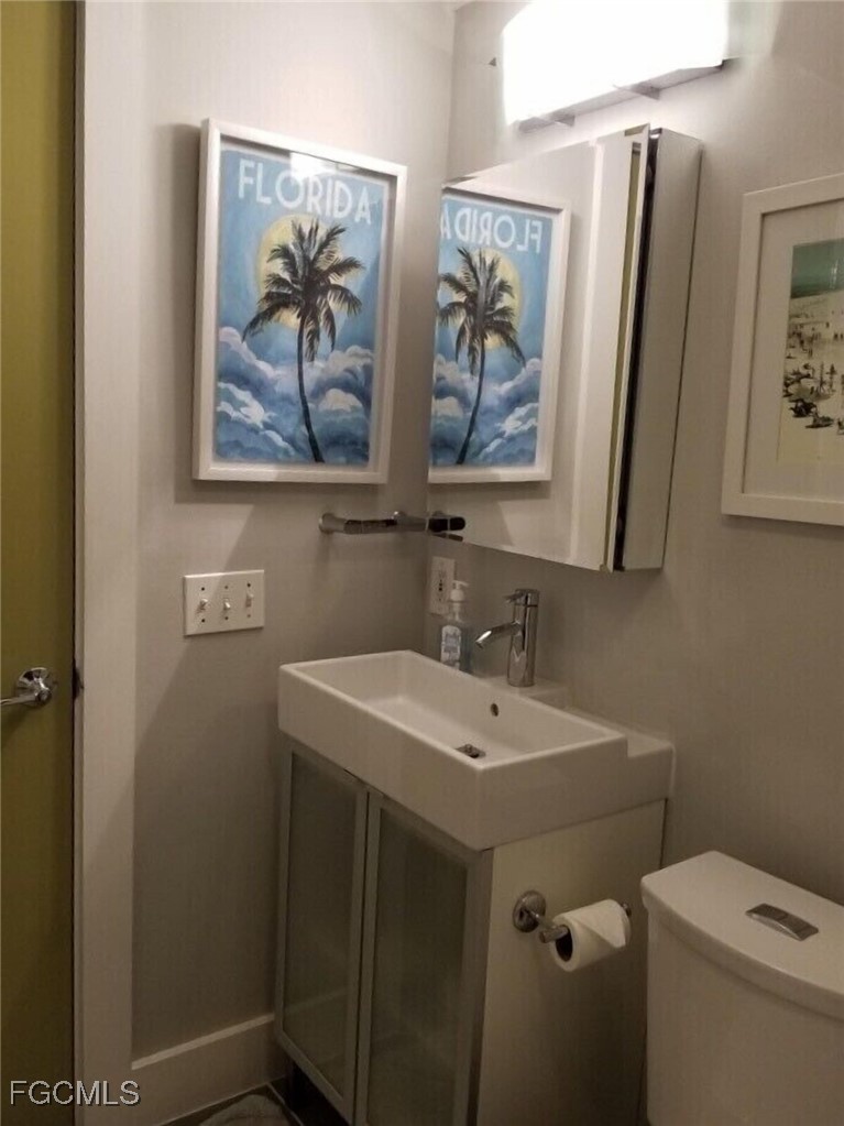 16111 Tortuga Street Bokeelia, FL 33922 - Photo 17 of 29 a bathroom with a sink and a mirror
