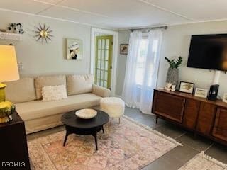 16111 Tortuga Street Bokeelia, FL 33922 - Photo 2 of 29 a living room with furniture a flat screen tv and a window