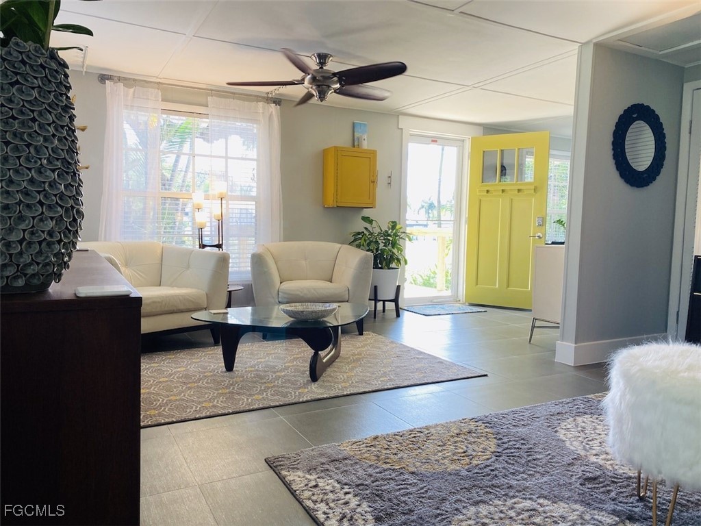 16111 Tortuga Street Bokeelia, FL 33922 - Photo 23 of 29 a living room with furniture and a window