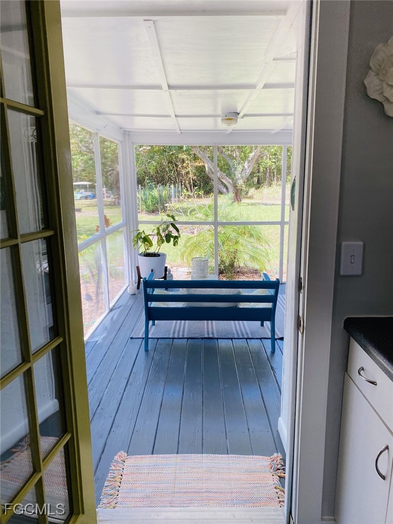 16111 Tortuga Street Bokeelia, FL 33922 - Photo 25 of 29 a view of two chairs in a balcony