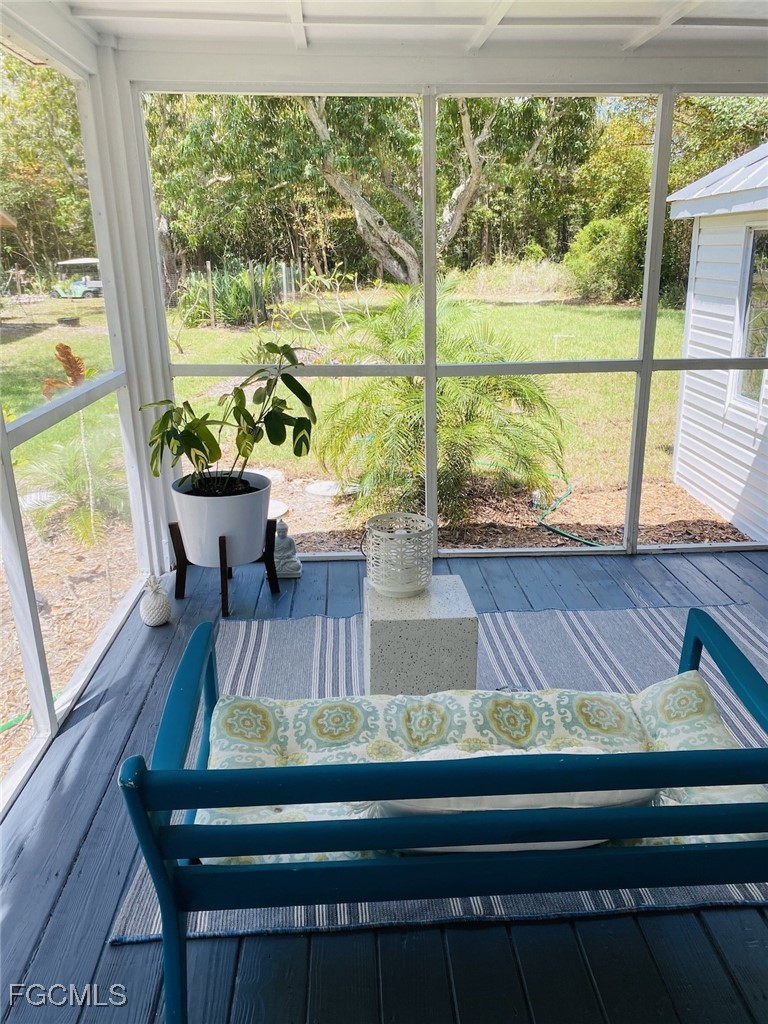 16111 Tortuga Street Bokeelia, FL 33922 - Photo 26 of 29 a view of a two chairs in the balcony