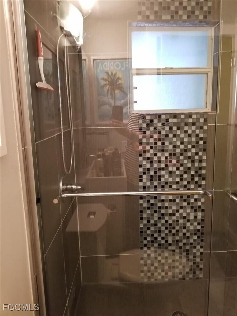 16111 Tortuga Street Bokeelia, FL 33922 - Photo 27 of 29 a bathroom with a shower