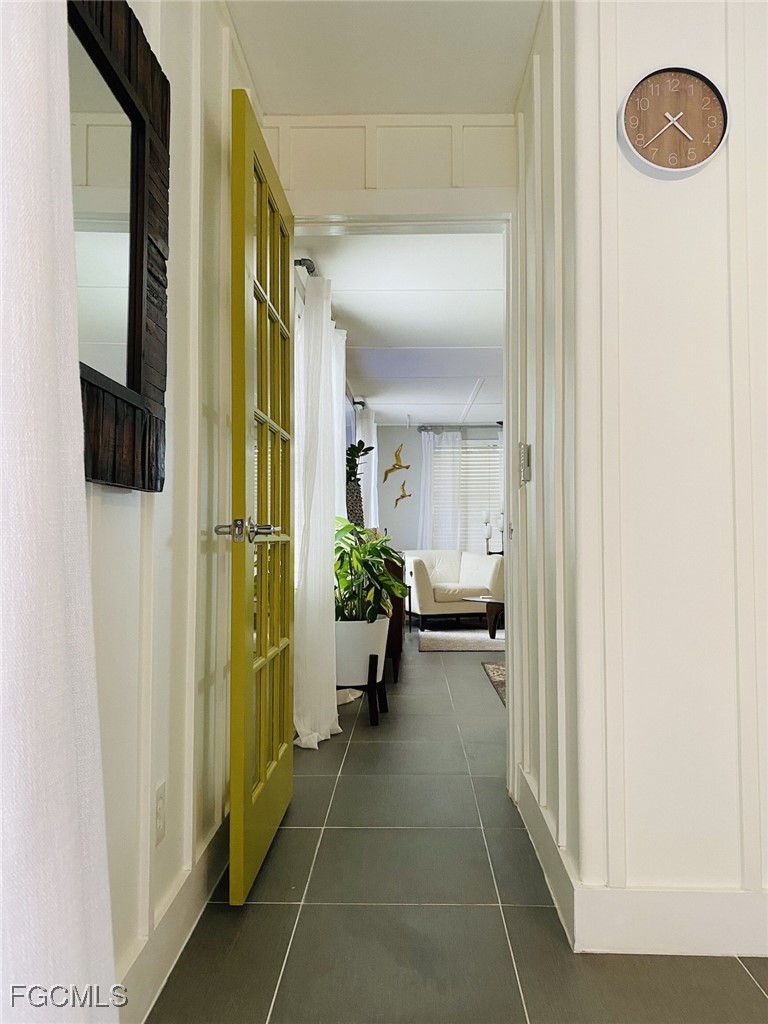 16111 Tortuga Street Bokeelia, FL 33922 - Photo 7 of 29 a view of a hallway with mirror and furniture