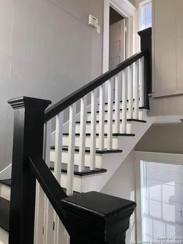 a view of a door and a window