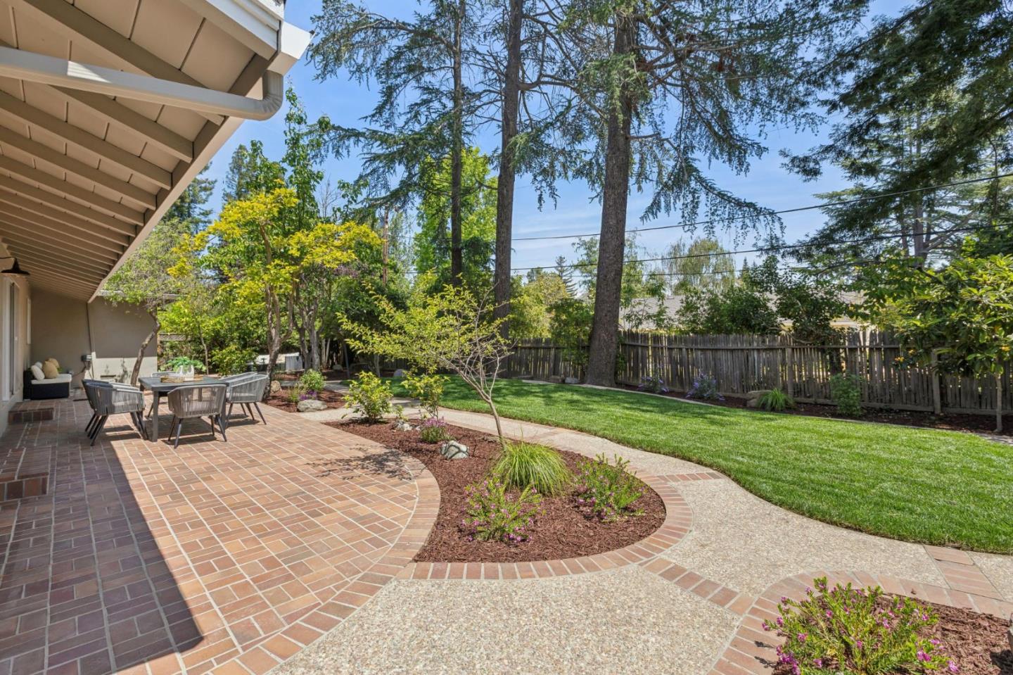 755 Santa Rita Avenue Los Altos, CA 94022 - Photo 41 of 50 a view of a backyard with sitting area