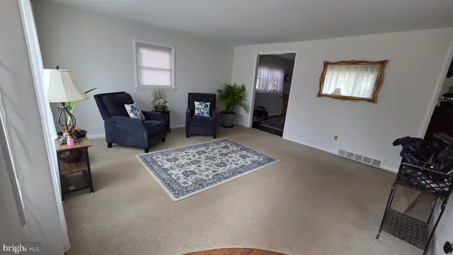 a living room with furniture and a rug