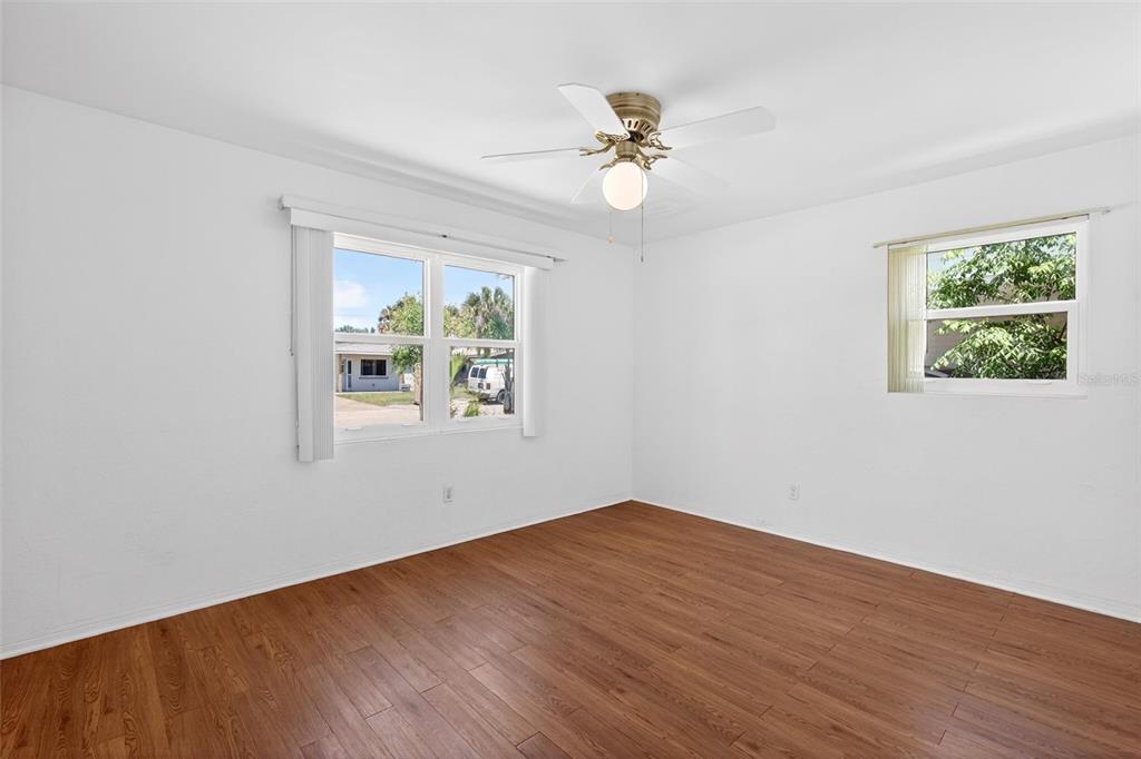 47 Carol Road Ormond Beach, FL 32176 - Photo 25 of 54 a view of an empty room with wooden floor and a window