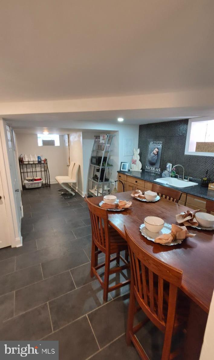 4113 Comly Street Philadelphia, PA 19135 - Photo 10 of 21 a kitchen with stainless steel appliances a table and chairs