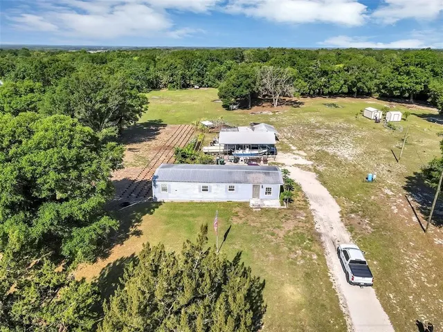 a view of a lake with a yard