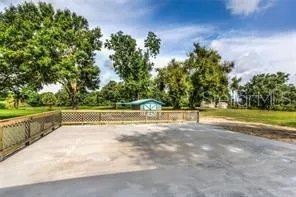 a view of a swimming pool with a yard