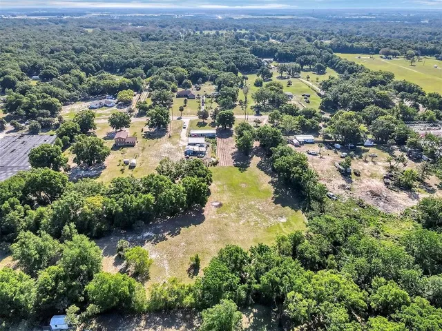 an aerial view of residential house with outdoor space