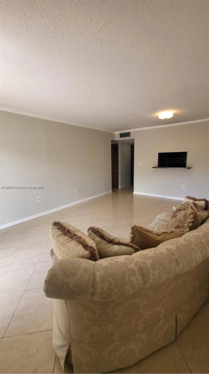 5199 Northwest 7th Street, Unit 309 Miami, FL 33126 - Photo 2 of 4 a bedroom with a bed and window