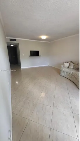 a view of a balcony with furniture and city view