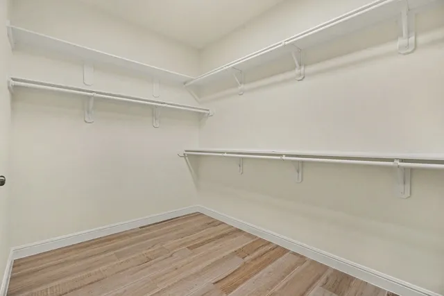 a view of an empty walk in closet