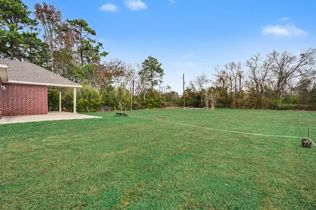 a view of a house with a big yard