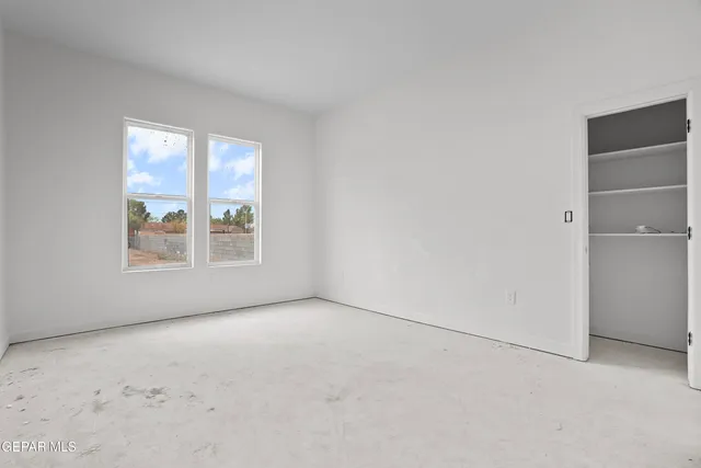 an empty room with windows