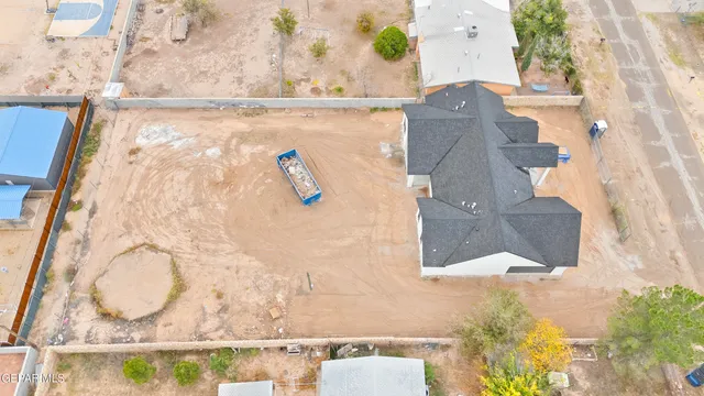 an aerial view of residential building with parking and ocean view