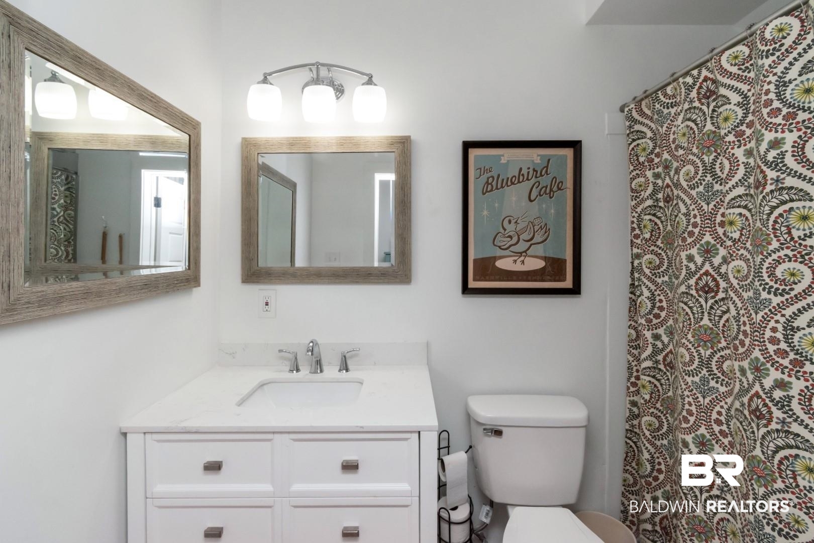 116 Item Avenue Mobile, AL 36607 - Photo 22 of 33 Bathroom featuring toilet and vanity