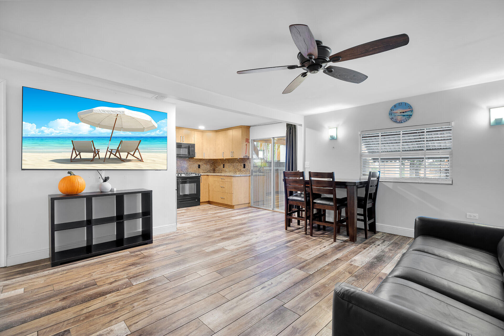 7 Avenue D Key Largo, FL 33037 - Photo 11 of 36 a living room with furniture kitchen view and a wooden floor