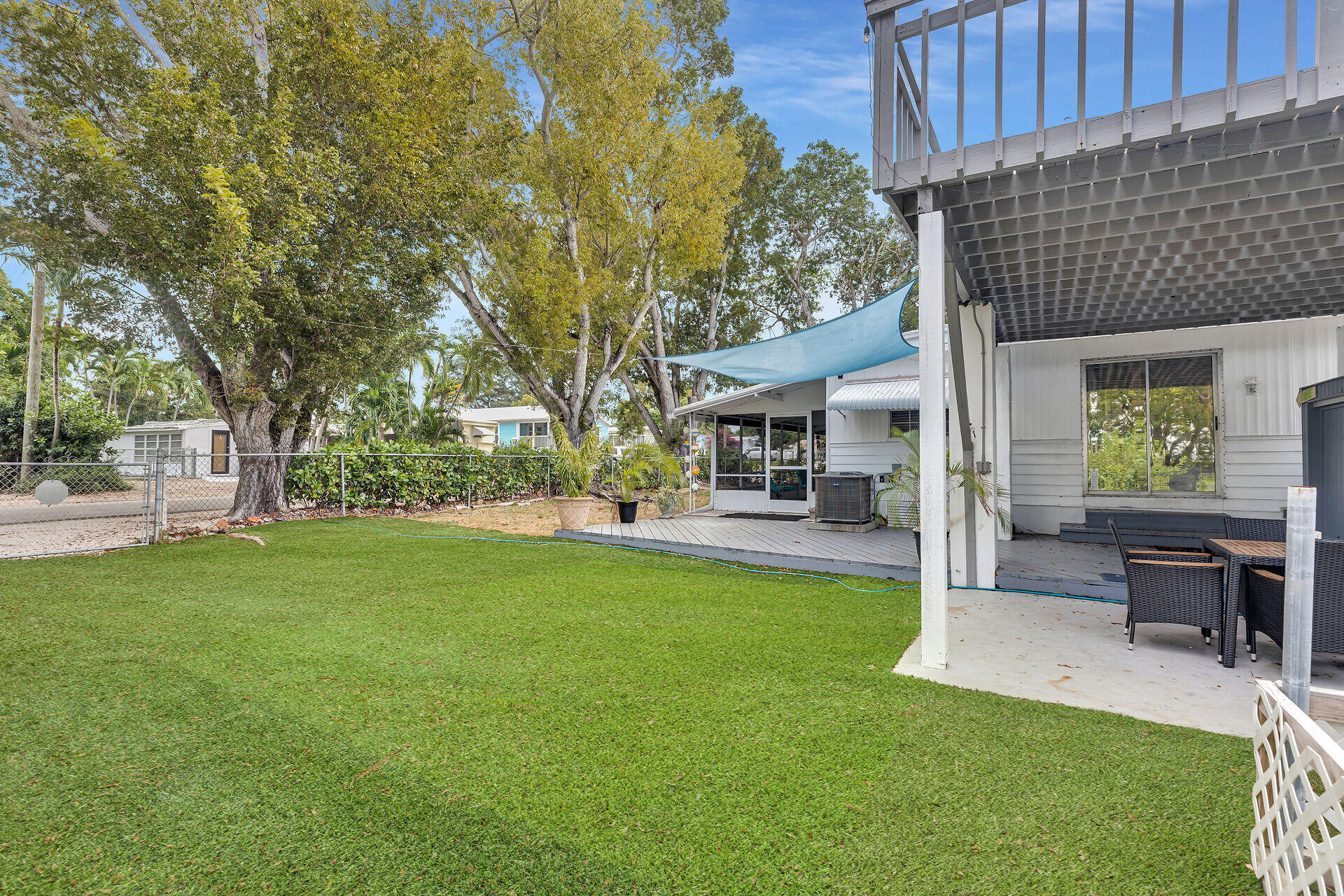 7 Avenue D Key Largo, FL 33037 - Photo 12 of 36 a view of a house with backyard porch and sitting area