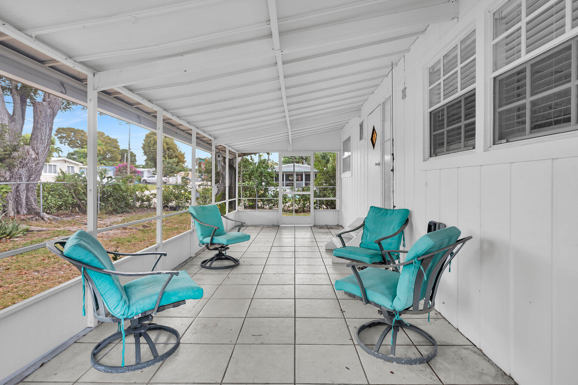 7 Avenue D Key Largo, FL 33037 - Photo 13 of 36 a building outdoor space with patio furniture and wooden floor