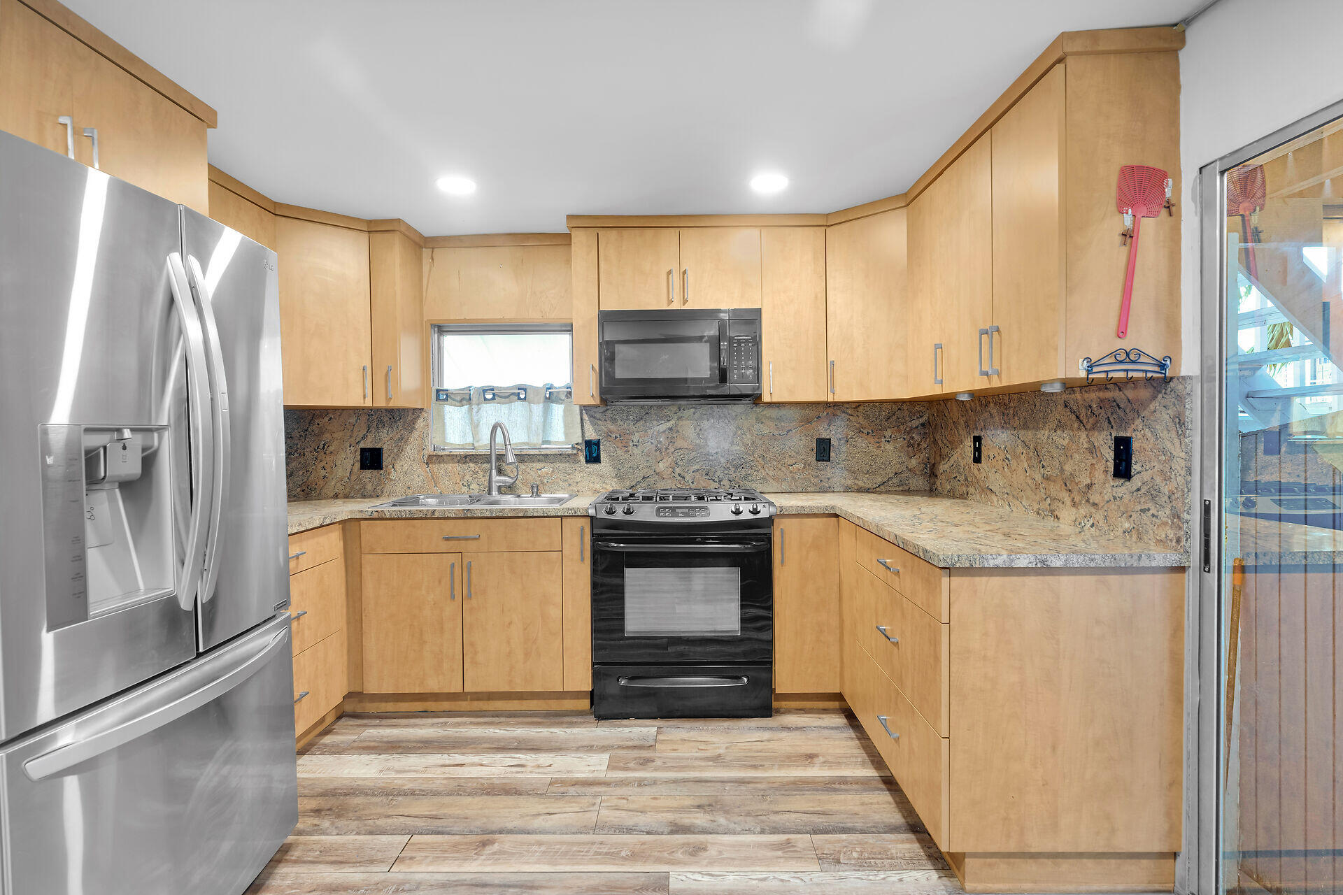 7 Avenue D Key Largo, FL 33037 - Photo 14 of 36 a kitchen with stainless steel appliances granite countertop a stove a sink and a refrigerator