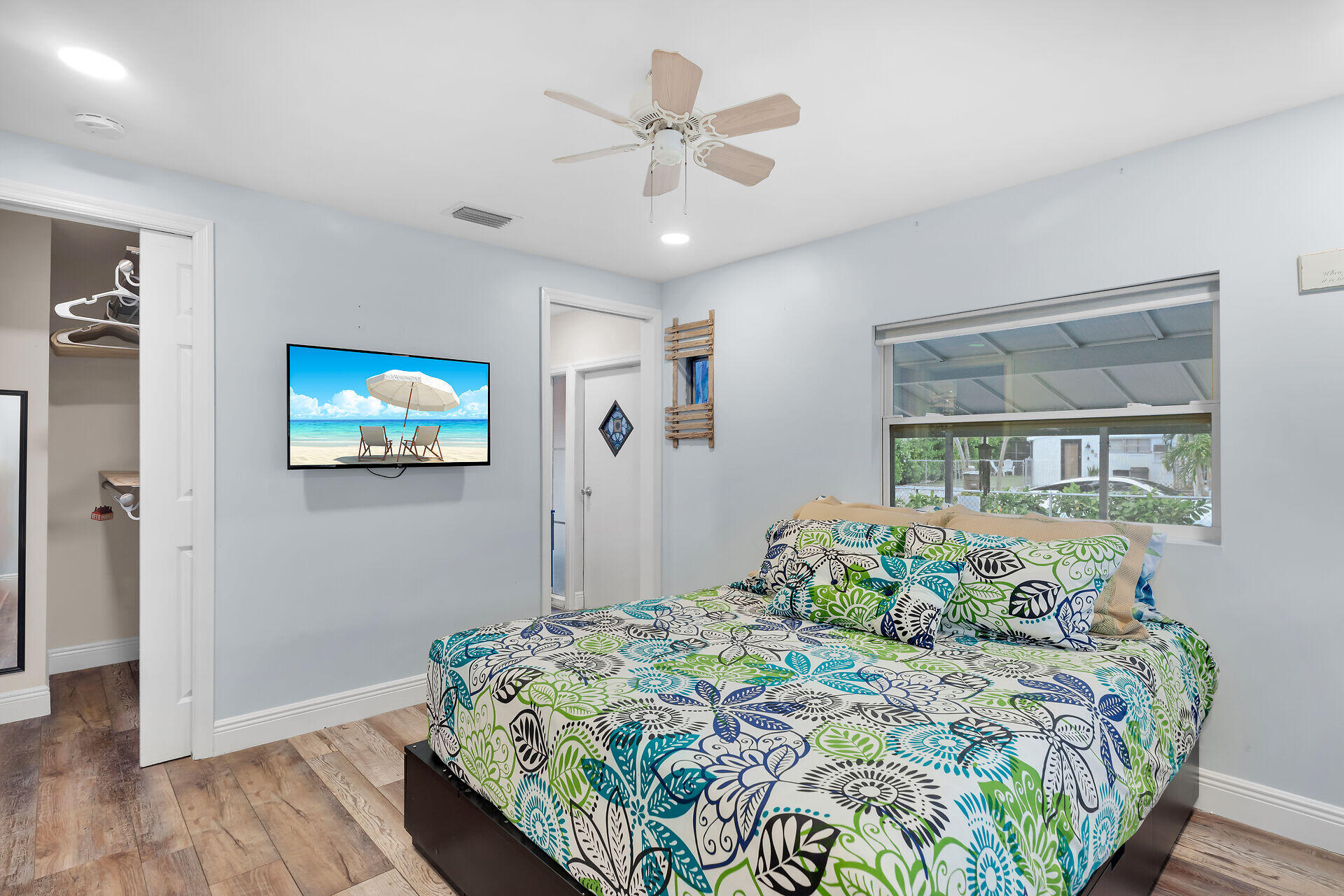 7 Avenue D Key Largo, FL 33037 - Photo 17 of 36 a bedroom with bed and a chandelier