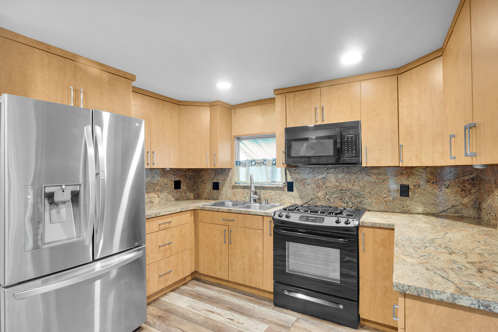 7 Avenue D Key Largo, FL 33037 - Photo 20 of 36 a kitchen with stainless steel appliances granite countertop a refrigerator stove microwave and sink