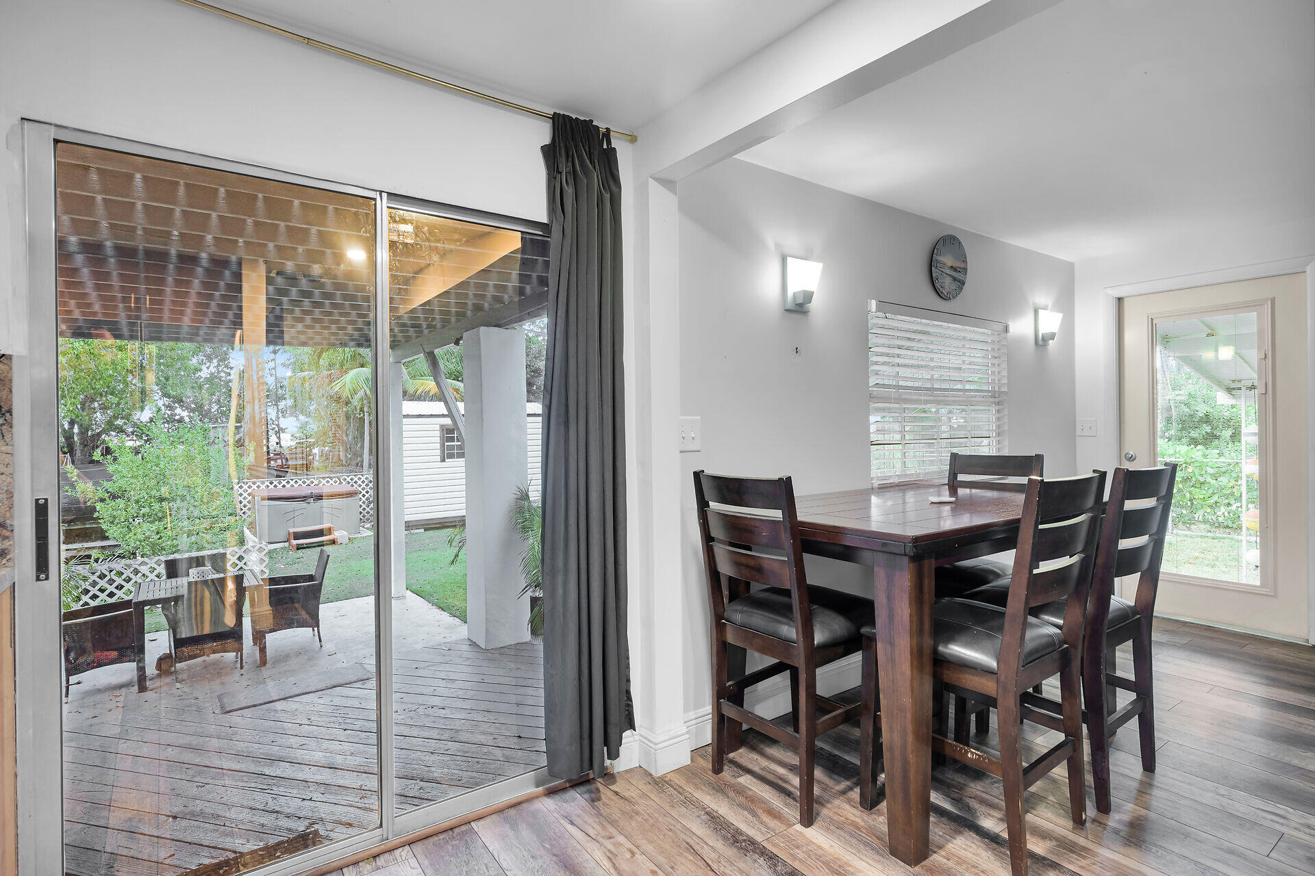7 Avenue D Key Largo, FL 33037 - Photo 21 of 36 a view of a dining room with furniture window and wooden floor