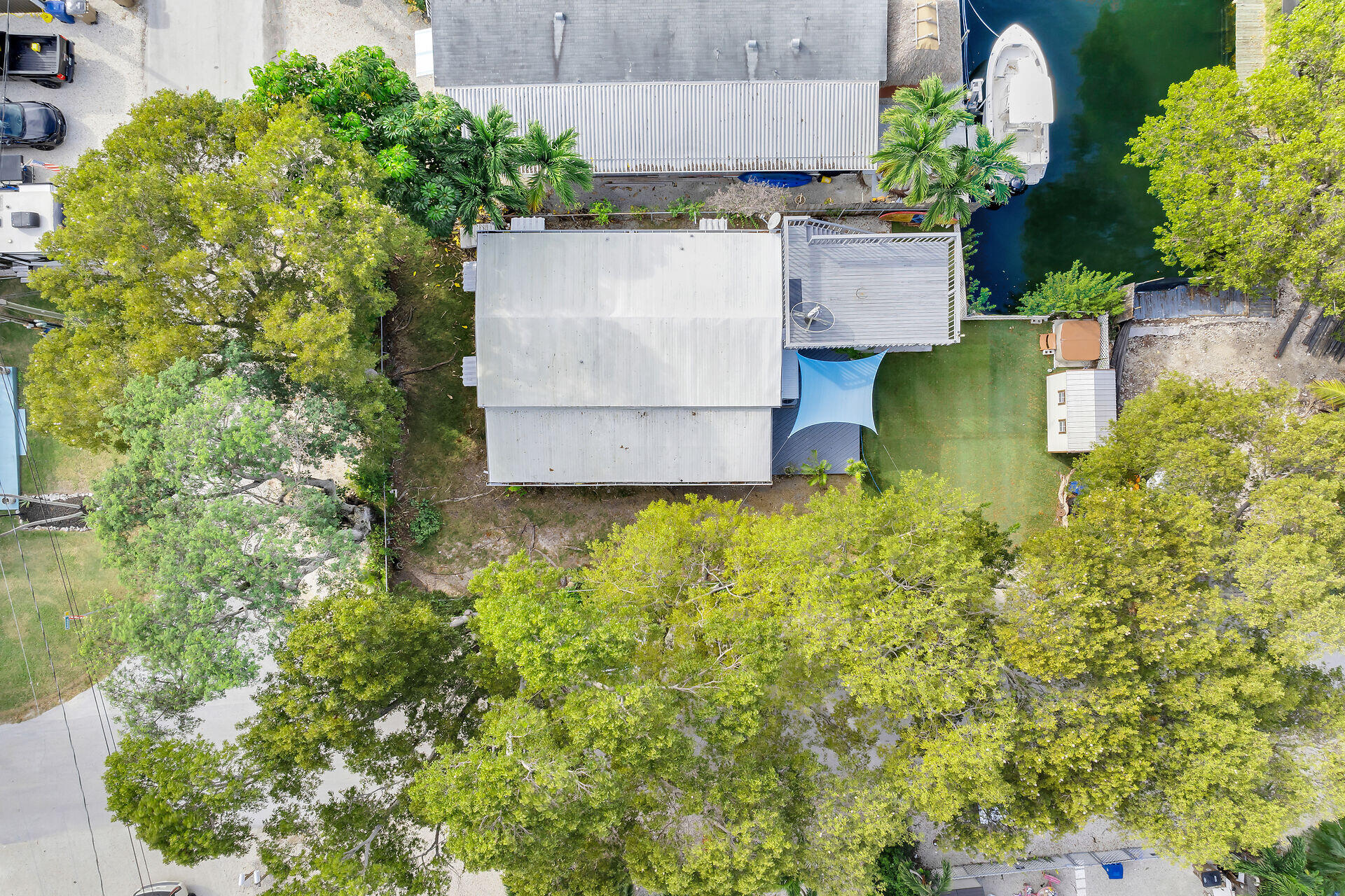 7 Avenue D Key Largo, FL 33037 - Photo 3 of 36 an aerial view of a house with swimming pool and garden
