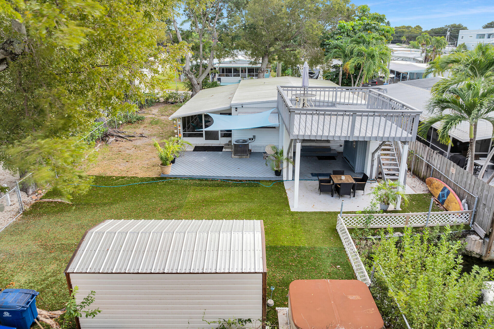 7 Avenue D Key Largo, FL 33037 - Photo 33 of 36 a view of house with swimming pool outdoor seating area and barbeque oven