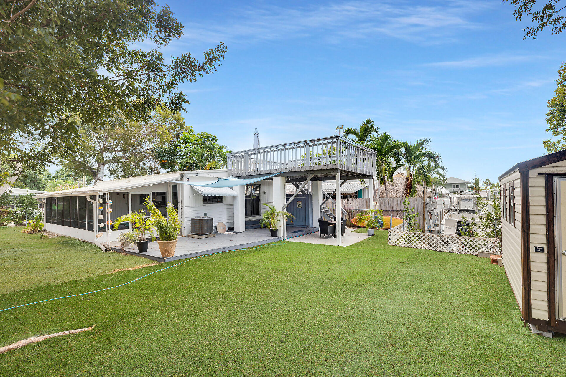 7 Avenue D Key Largo, FL 33037 - Photo 6 of 36 a view of a house with sitting area and garden