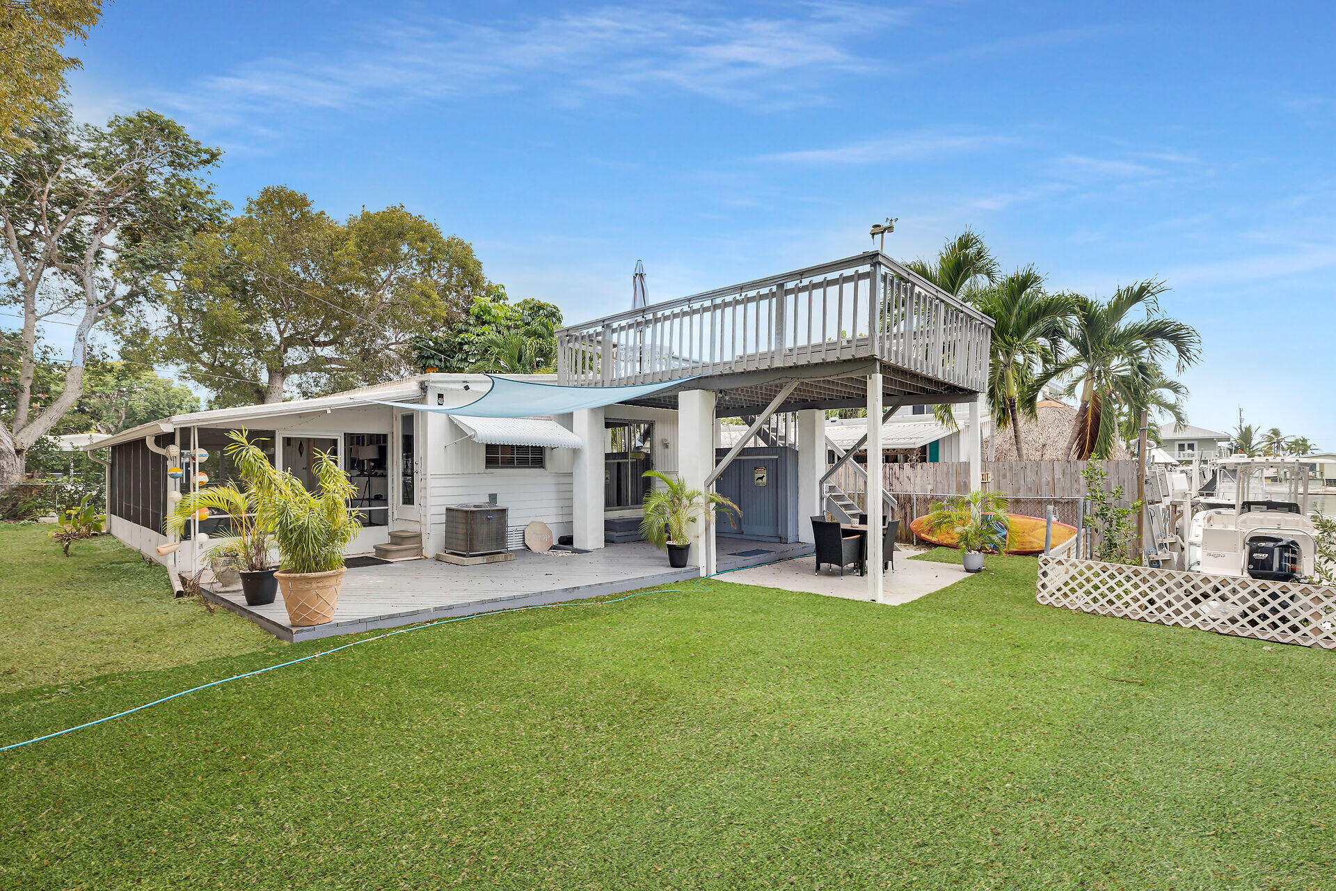 7 Avenue D Key Largo, FL 33037 - Photo 7 of 36 a view of a house with backyard porch and sitting area